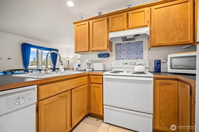 kitchen with sink and white appliances