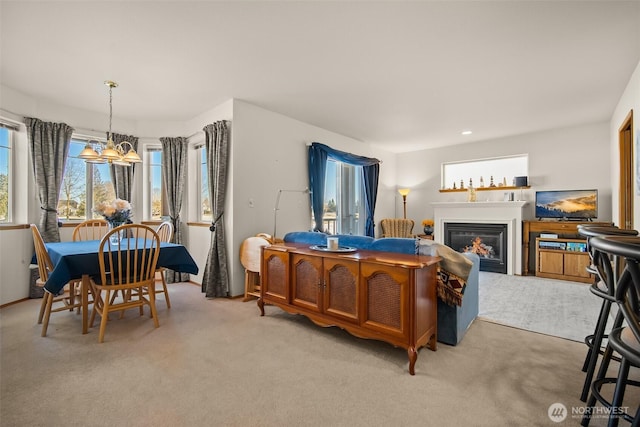 carpeted bedroom featuring an inviting chandelier