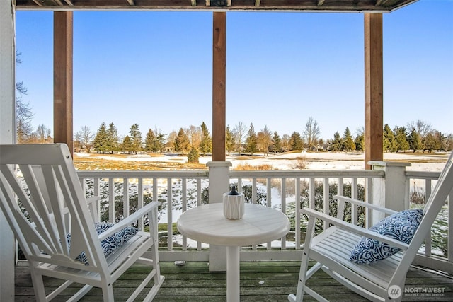 balcony with a deck with water view