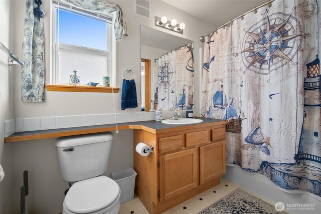 full bathroom with vanity, toilet, and shower / bathtub combination with curtain