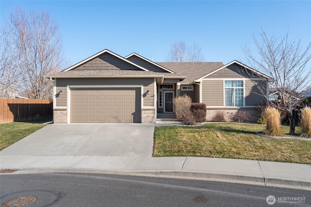 view of front of property with a front lawn and a garage