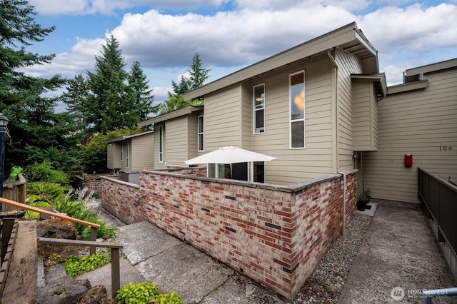 220 SW 200th St Unit 186, Normandy Park, WA 98166 - rear view of house featuring brick siding