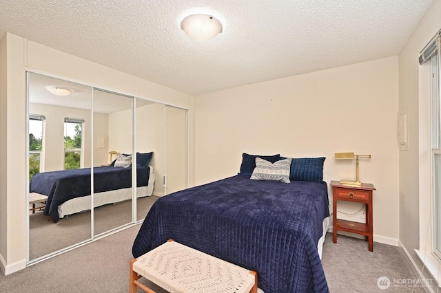 220 SW 200th St Unit 186, Normandy Park, WA 98166 - carpeted bedroom with a textured ceiling and a closet