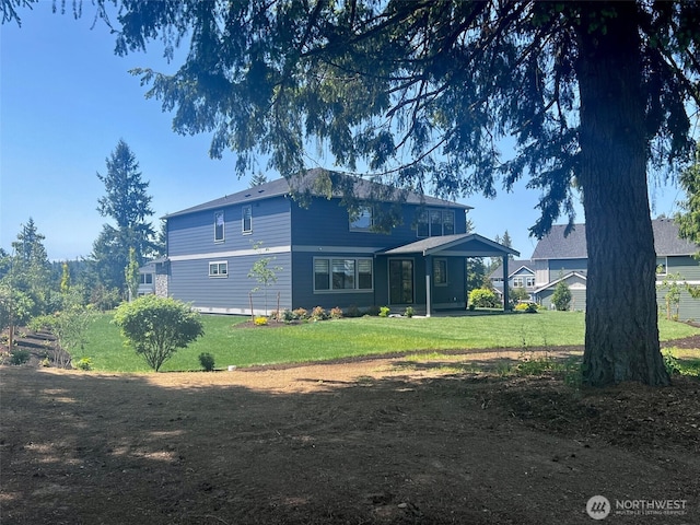 13519 102nd Dr SE Unit 16, Snohomish, WA 98296 - rear view of property featuring a lawn