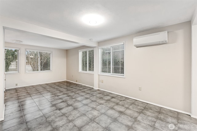 unfurnished room with a wall mounted air conditioner