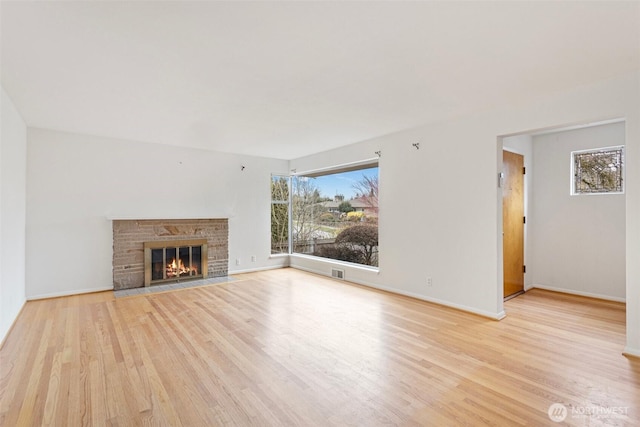 unfurnished living room with light hardwood / wood-style floors