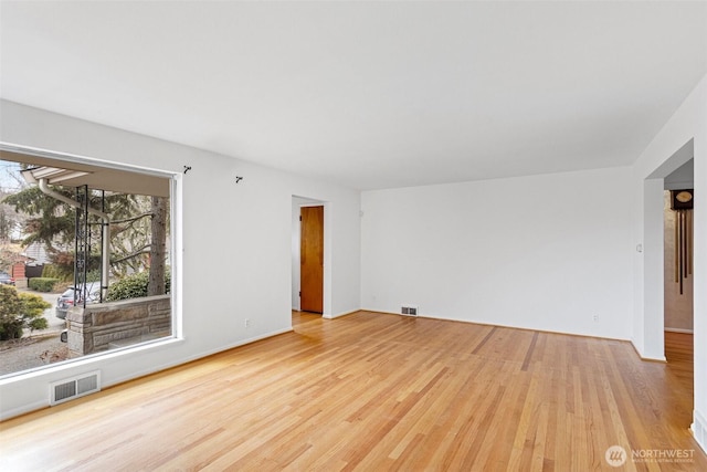 unfurnished room featuring light hardwood / wood-style floors