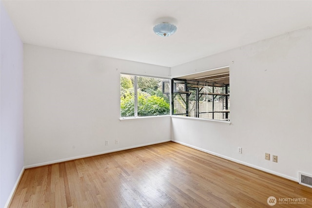 empty room featuring hardwood / wood-style floors