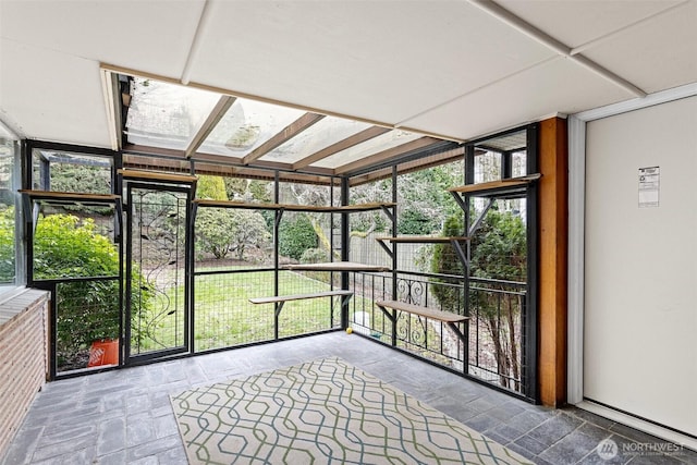 unfurnished sunroom with a wealth of natural light