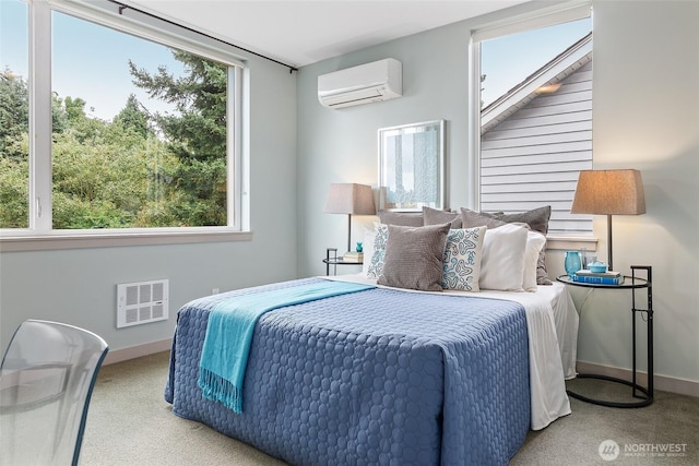 bedroom with light carpet, baseboards, and a wall mounted AC