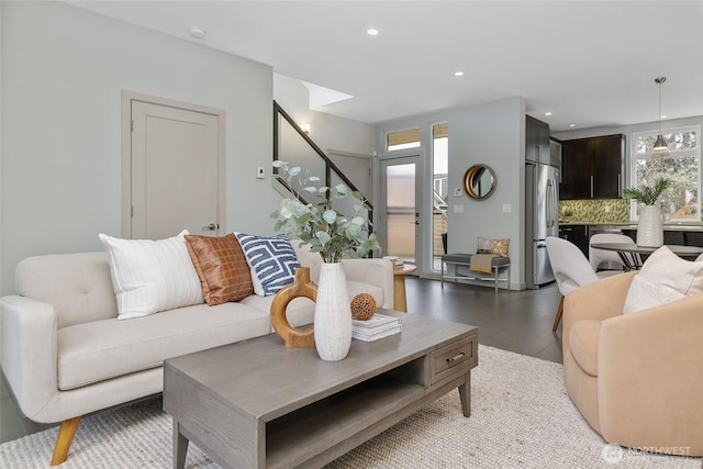 living room with recessed lighting and stairway