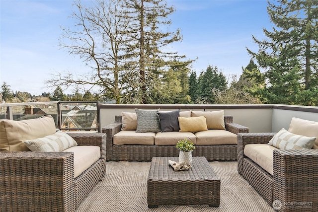 wooden terrace with outdoor lounge area