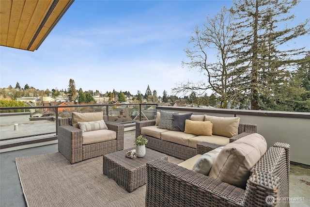 view of patio featuring a balcony and an outdoor living space