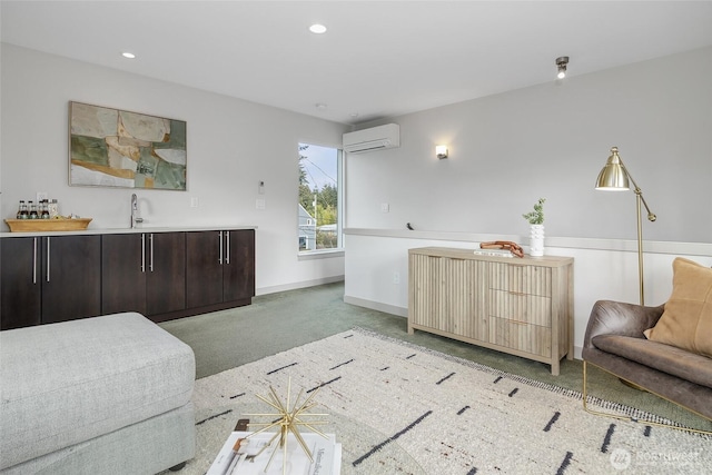 interior space with recessed lighting, baseboards, indoor wet bar, and a wall mounted AC