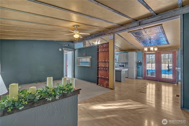 28622 SE 434th St, Enumclaw, WA 98022 - interior space with french doors, wood-type flooring, ceiling fan with notable chandelier, and vaulted ceiling with beams