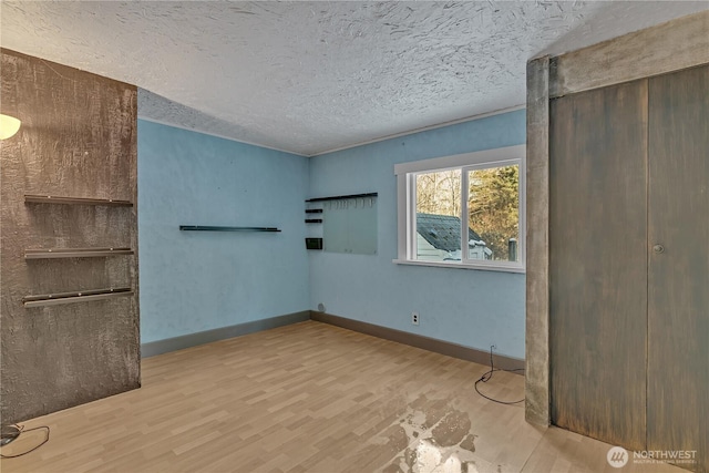 28622 SE 434th St, Enumclaw, WA 98022 - unfurnished bedroom with a textured ceiling and light hardwood / wood-style flooring