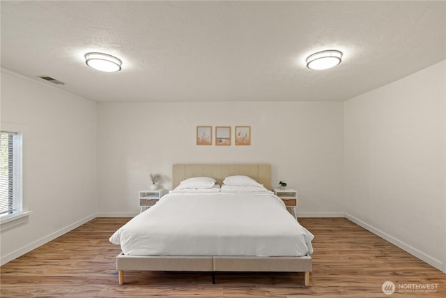 1508 Hoquiam Ln S, Westport, WA 98595 - bedroom featuring hardwood / wood-style floors and a textured ceiling