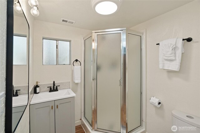 1508 Hoquiam Ln S, Westport, WA 98595 - bathroom featuring vanity, toilet, and a shower with shower door