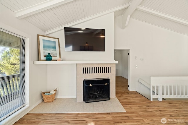 1508 Hoquiam Ln S, Westport, WA 98595 - living room with vaulted ceiling with beams, hardwood / wood-style flooring, and a fireplace