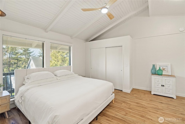 1508 Hoquiam Ln S, Westport, WA 98595 - bedroom with vaulted ceiling with beams, hardwood / wood-style floors, ceiling fan, and a closet
