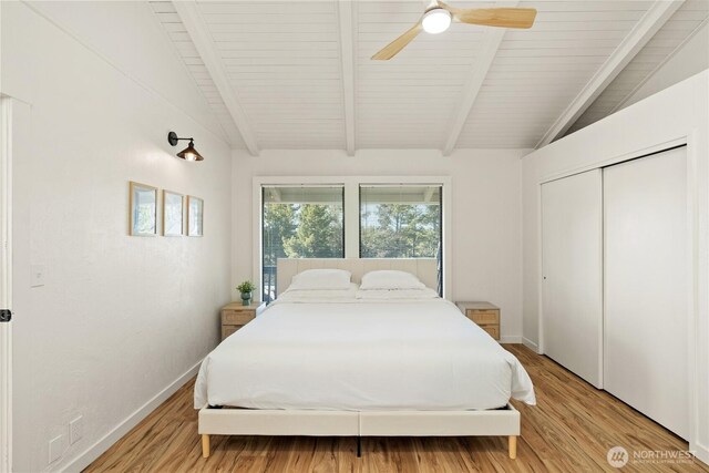 1508 Hoquiam Ln S, Westport, WA 98595 - bedroom featuring ceiling fan, vaulted ceiling with beams, light wood-type flooring, and a closet