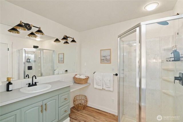 1508 Hoquiam Ln S, Westport, WA 98595 - bathroom featuring vanity, wood-type flooring, and a shower with shower door