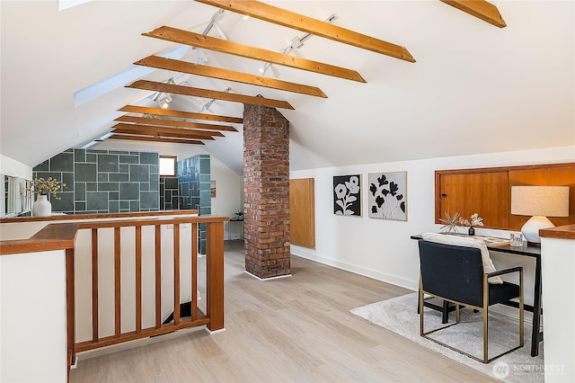 office with vaulted ceiling with beams, light wood-style flooring, and baseboards