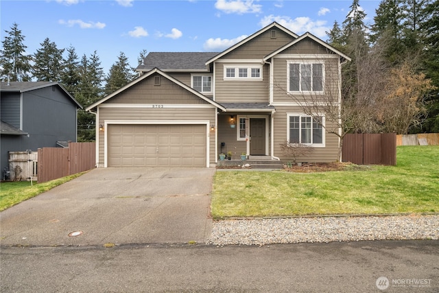 view of front of home featuring a garage and a front yard