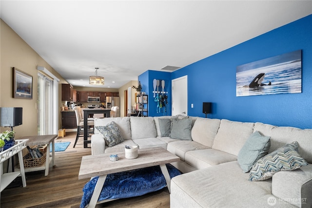 living room featuring dark wood-type flooring