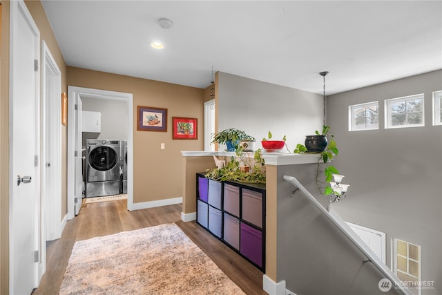 interior space featuring dark hardwood / wood-style flooring and washer and clothes dryer