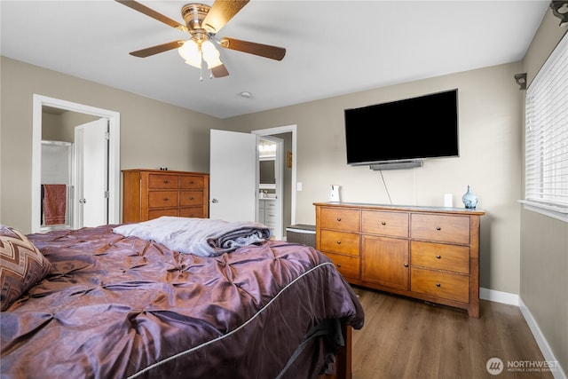 bedroom with light hardwood / wood-style floors, ceiling fan, and ensuite bathroom