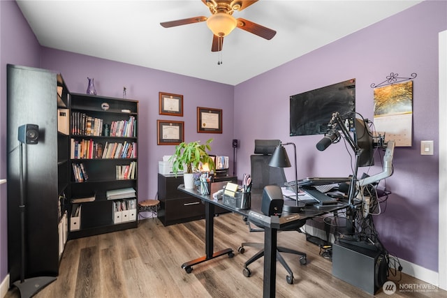 office space with hardwood / wood-style floors and ceiling fan