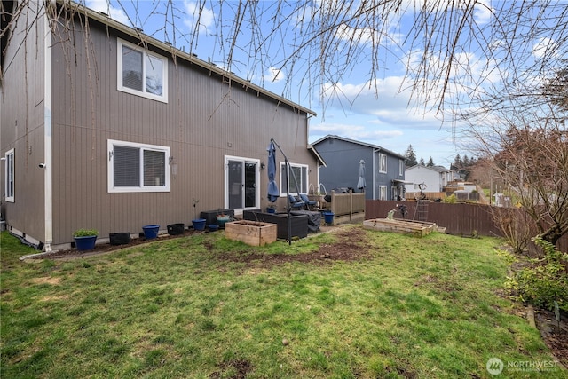 back of house featuring a yard