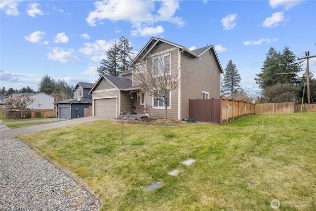 view of front of home with a garage and a front yard