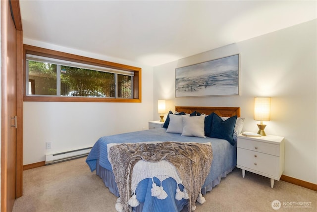 bedroom featuring carpet floors, baseboard heating, and baseboards