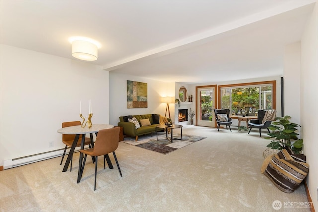 living area featuring carpet, a fireplace, and baseboard heating