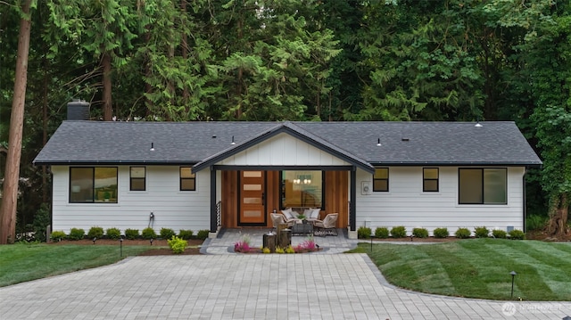 2641 271st Ave SE, Issaquah, WA 98029 - single story home featuring a front lawn, board and batten siding, a porch, and roof with shingles