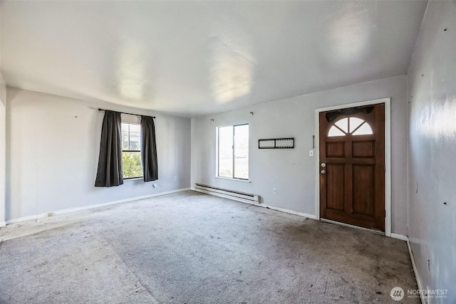 carpeted entrance foyer featuring baseboard heating