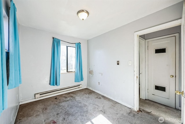 empty room featuring a baseboard heating unit