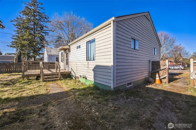 view of property exterior with a deck