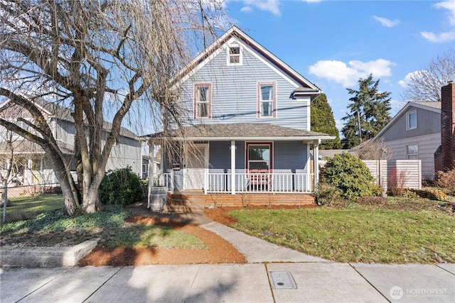 view of front of home featuring a porch and a front lawn