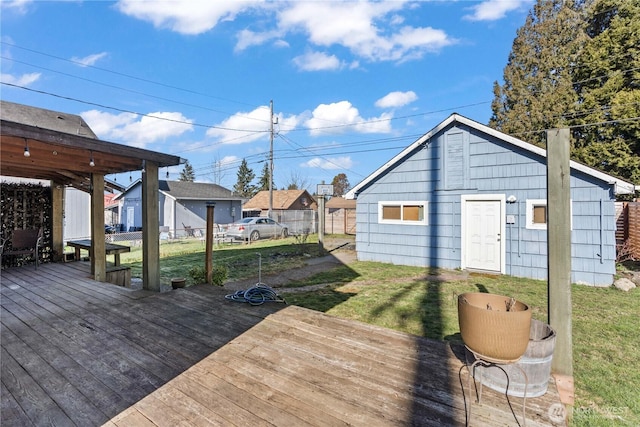 wooden deck featuring a yard