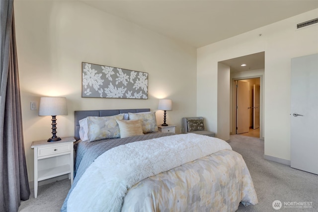 bedroom with light colored carpet