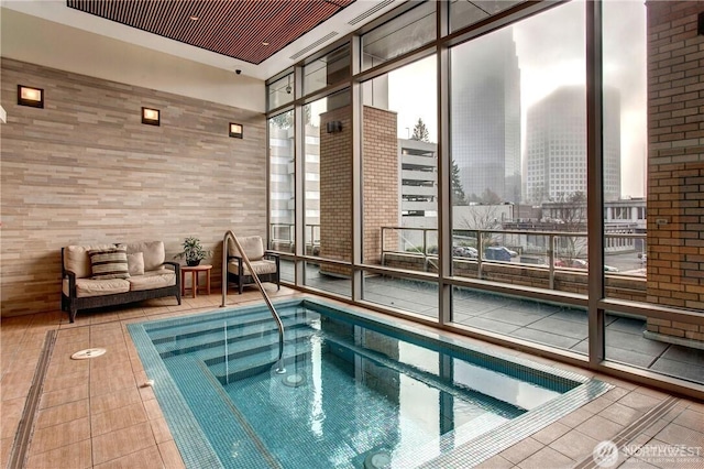 view of swimming pool featuring an indoor in ground hot tub