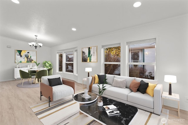 living room with ornamental molding, light hardwood / wood-style floors, and a notable chandelier