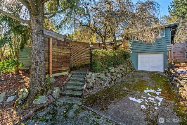 view of yard featuring a garage