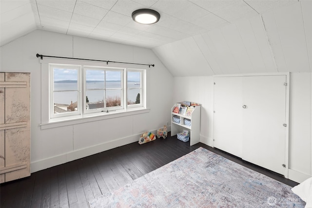 bonus room featuring lofted ceiling and dark hardwood / wood-style floors