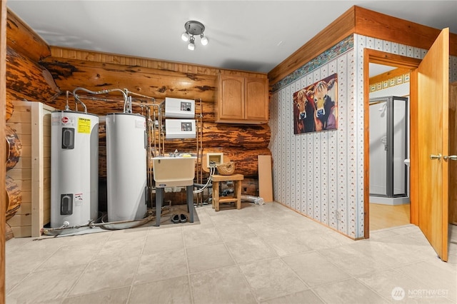 utility room with gas water heater, water heater, and a sink