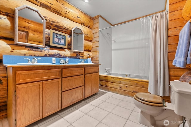 bathroom featuring double vanity, a sink, tile patterned flooring, toilet, and shower / tub combo with curtain