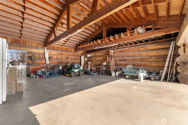 garage with freestanding refrigerator